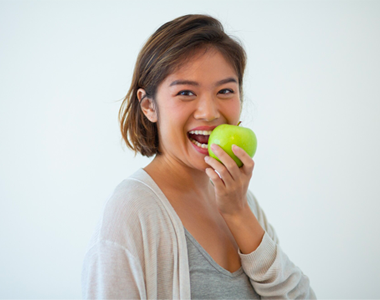 Women eating an apple